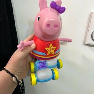 Peppa pig on roller skates battery operated Pink Piggy Toy with Yellow Wheels